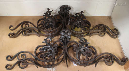 A set of five 19th century French wrought iron scrollwork mounts with flowerhead terminals, width