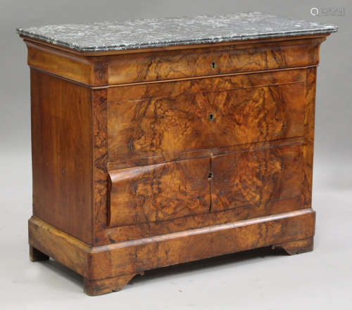 An early 20th century Louis Philippe style walnut commode, the grey marble top above three long