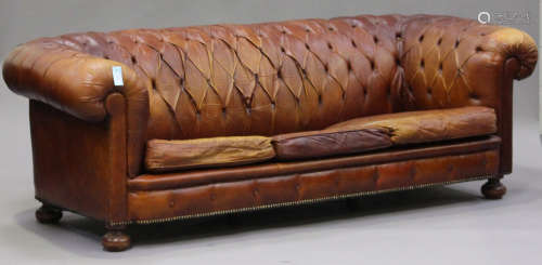 A mid/late 20th century brown buttoned leather Chesterfield settee with brass studwork decoration,