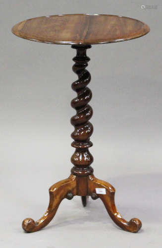 A 19th century rosewood circular wine table, the dished top raised on a barley twist column and