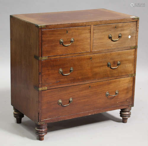 A late Victorian mahogany campaign style chest of two short and two long drawers with brass bound