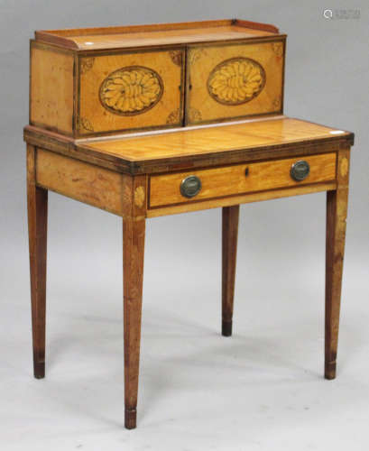 A George III Sheraton period satinwood bonheur-du-jour with inlaid shell and fan paterae within