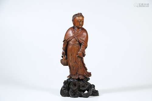 A Chinese Carved Zitan Buddha