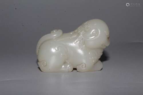 A CARVED WHITE JADE LION .QING DYNASTY