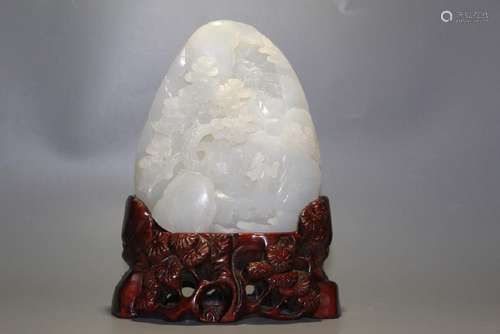 A CARVED WHITE JADE 'LANDSCAPE' BOULDER.