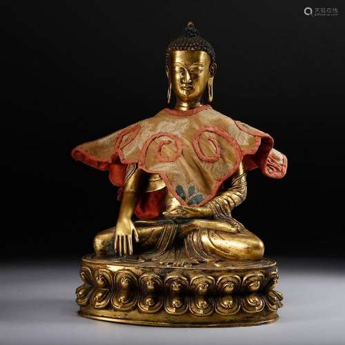 A GILT-BRONZE FIGURE OF SHAKYAMUNI.MING DYNASTY