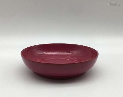 A RUBY-GLAZED DISH.MARK OF YONGZHENG