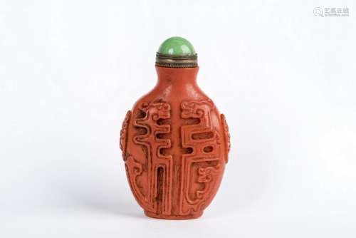 AN IRON RED PORCELAIN SNUFF BOTTLE