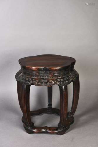 A PETAL-LOBED SHAPED HARDWOOD STOOL