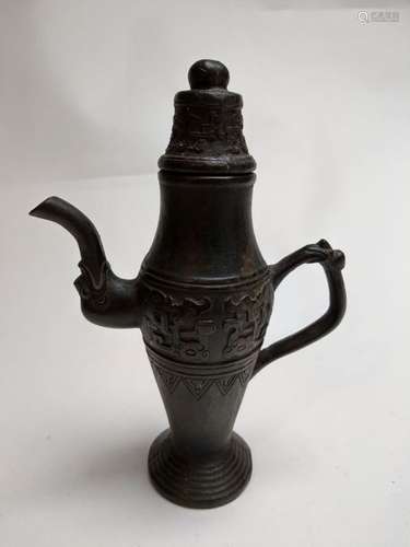 Zhou style bronze ewer \nFeaturing Taotie. Bottom i…