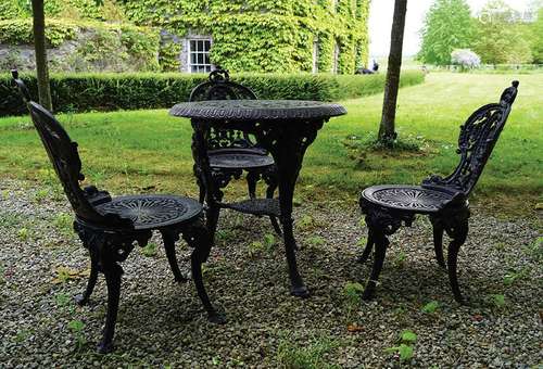 CAST IRON PATIO TABLE AND CHAIRS