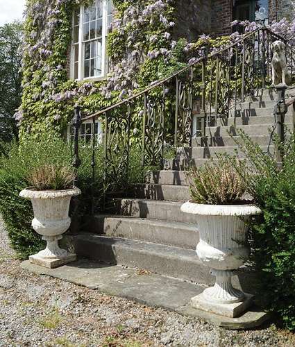 PAIR OF GEORGIAN CAST IRON URNS