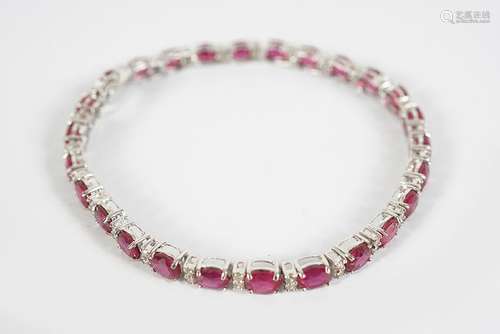 18 CT. WHITE GOLD RUBY AND DIAMOND BRACELET