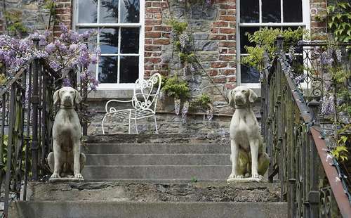 PAIR OF MOULDED STONE DOGS