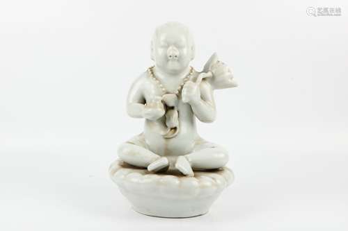 A Chinese White Glazed Porcelain Buddha