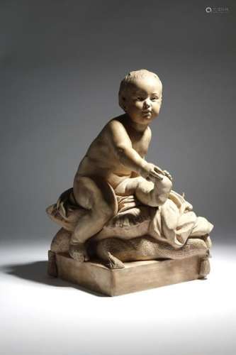 A French terracotta figure of an infant in the man…