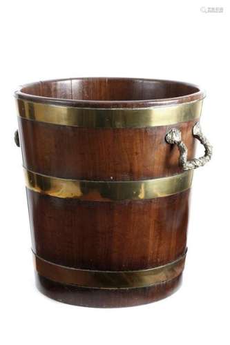 A George III mahogany and brass bound peat bucket,…