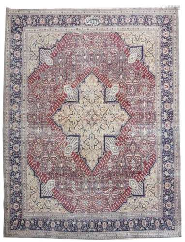 A Kirman Laver carpet, the border with a cartouche…