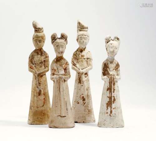 Four Chinese unglazed pottery figures of ladies, e…