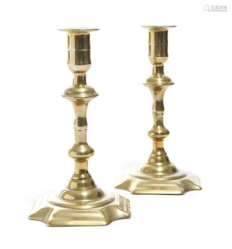 A pair of George II brass candlesticks by George G…