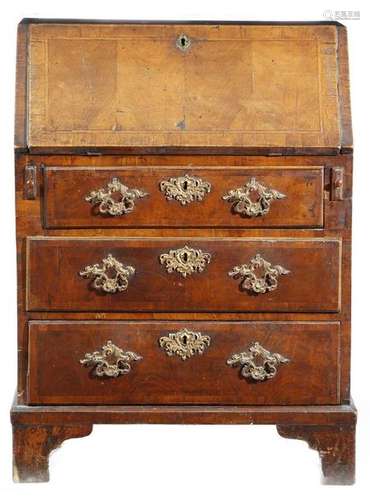 A George II walnut bureau, with cross and feather …