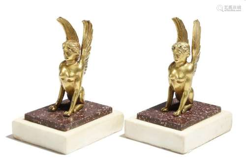 A pair of gilt bronze sphinx desk ornaments, mount…