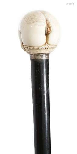 Λ An erotic walking cane, the carved ivory handle …