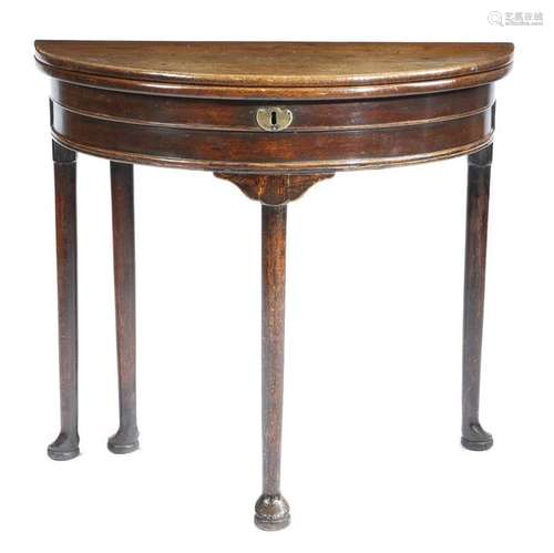 A George II oak demi lune tea table, the twin hing…