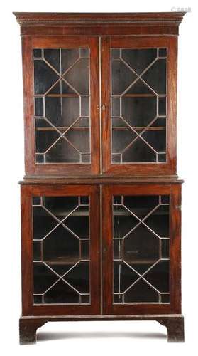 A George III mahogany bookcase, the Greek key corn…