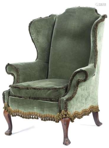 A walnut wing armchair in early 18th century style…
