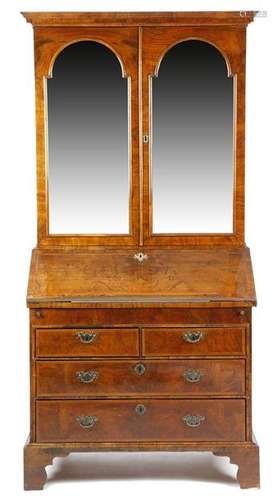 An early 18th century walnut bureau cabinet, the m…