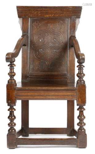 An oak panelled back open armchair in 17th century…