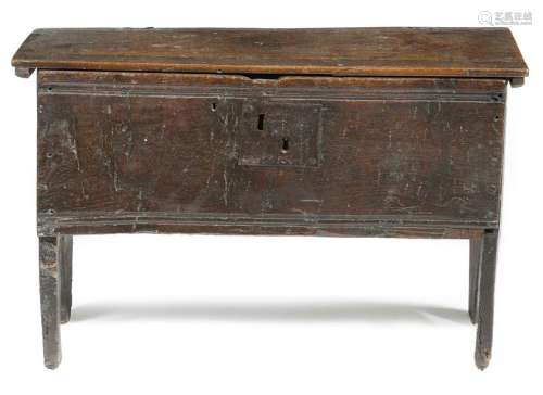 A small early 17th century oak boarded coffer, the…
