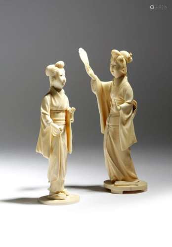 Λ Two Japanese ivory okimono of geishas, with engr…