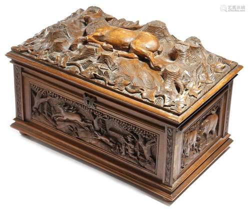 A Black Forest box, the hinged lid carved with a d…