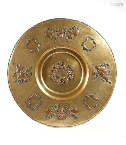 An Indian brass and copper charger, with engraved …