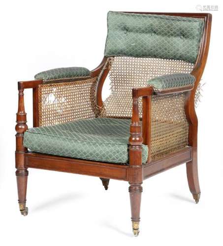 A George IV mahogany bergère armchair, with a cane…