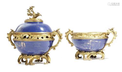 A pair of Napoleon III ormolu mounted porcelain po…