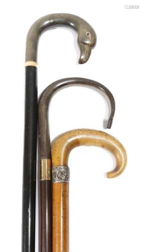 Three horn handled walking canes, comprising: a la…