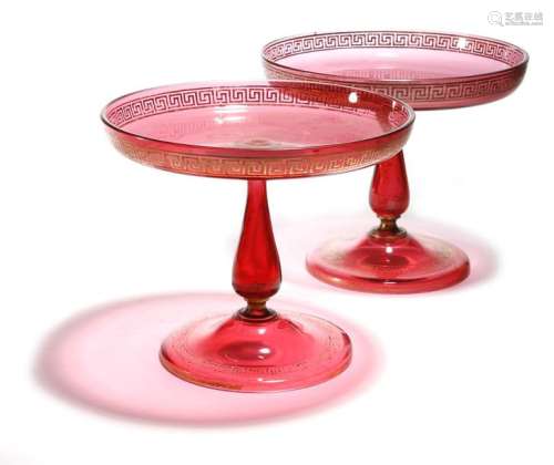 A matched pair of Victorian ruby glass tazze, with…