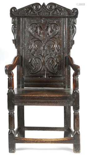 An oak panelled back open armchair in 17th century…