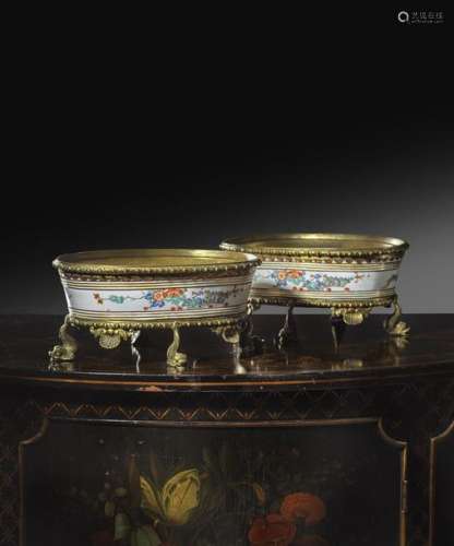 A pair of continental porcelain and ormolu mounted…