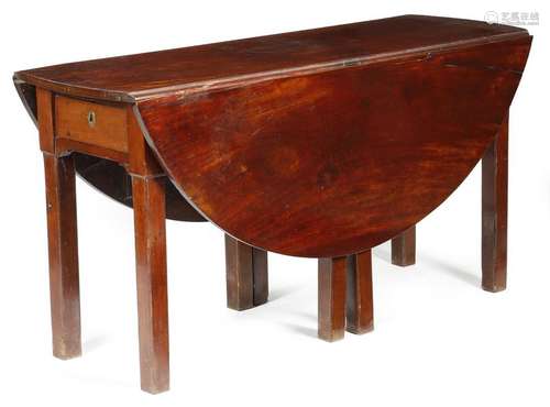 A George III mahogany wake style dining table, the…