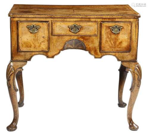 A walnut lowboy in George II style, the quarter ve…