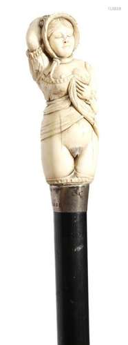 Λ An Edwardian erotic walking cane, the ivory hand…