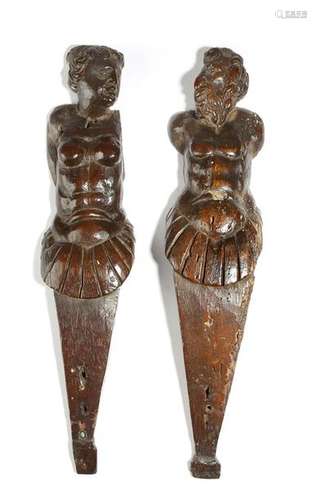 Two 16th century carved walnut figural terms, of a…