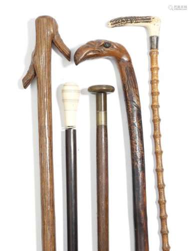 Λ Five walking canes, comprising: a folk art naive…