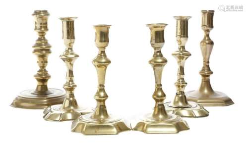 Two pairs of George II brass candlesticks, each wi…