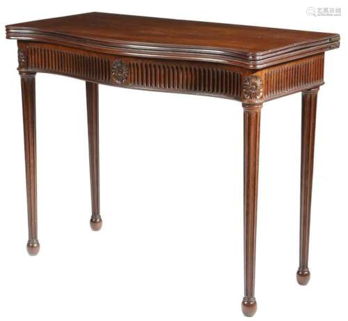 A George III mahogany serpentine front card table,…