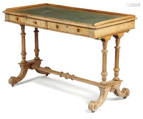 A Victorian walnut writing table, the top with a t…